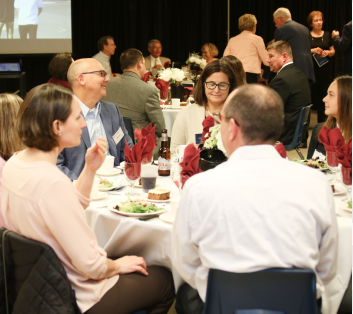 group of men and women enjoying a banquet event